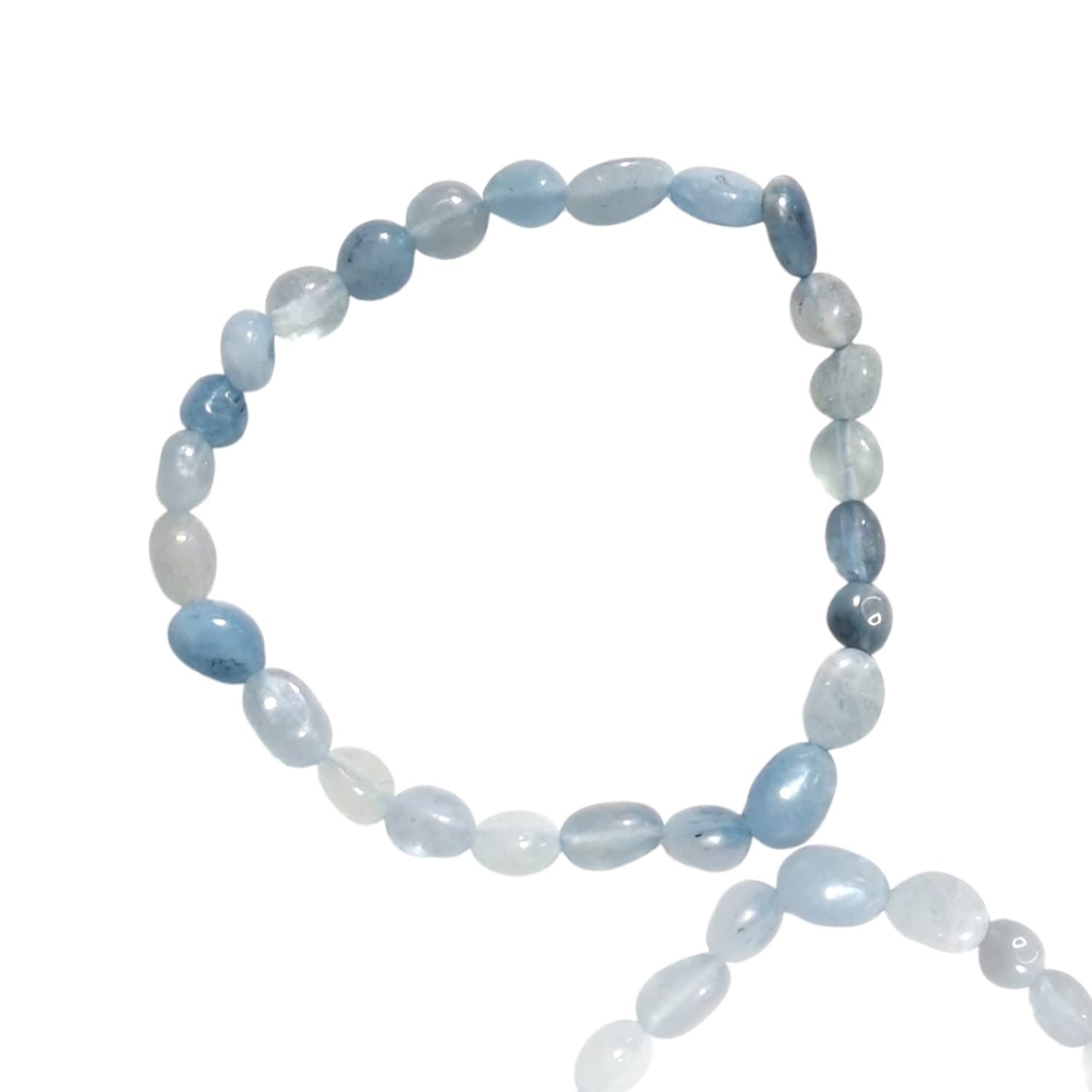 GeoFossils stretch nugget bracelet made from aquamarine stones in soft, translucent shades of pale blue and light sea-green. The stones are irregularly shaped and polished, reflecting their natural ocean-inspired beauty. The elastic band ensures a flexible fit, and the cool, calming tones of the aquamarine evoke a serene, refreshing aesthetic reminiscent of clear waters