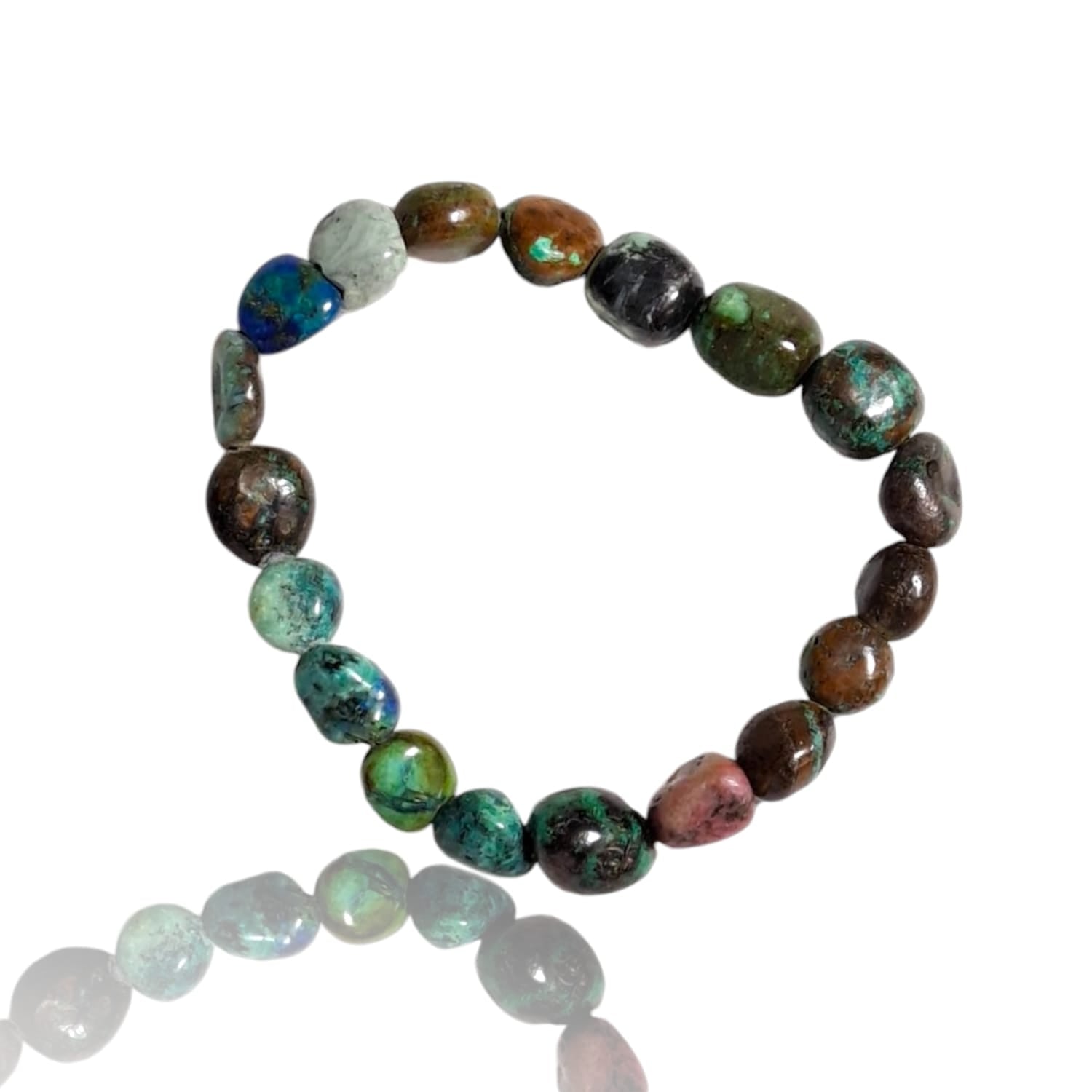 "GeoFossils stretch nugget bracelet made from polished chrysocolla stones in varying shades of turquoise, teal, and deep green. The stones are irregular in shape, highlighting their natural beauty and texture. The bracelet has a simple, elastic design, allowing it to easily stretch to fit different wrist sizes. The vibrant, earthy tones of chrysocolla evoke a calming, nature-inspired aesthetic."