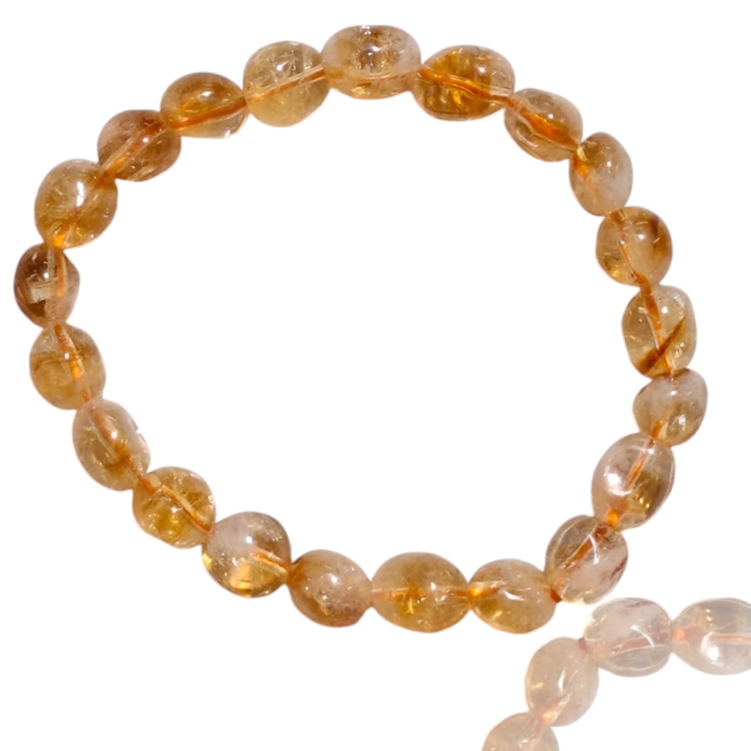 GeoFossils stretch nugget bracelet made from citrine stones in warm, translucent shades of golden yellow, honey, and light amber. The stones are irregularly shaped and polished, radiating a natural, sunlit glow. The elastic band provides a flexible, comfortable fit, and the vibrant, energizing tones of citrine create a joyful, uplifting aesthetic.