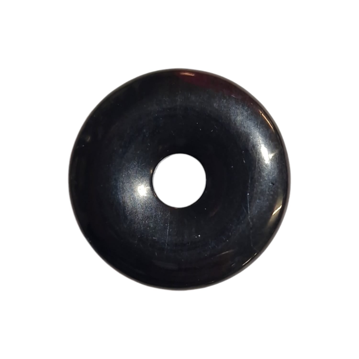 Jet Munay Ki Pi Donut by GeoFossils – smooth, deep black circular stone, perfect for grounding, protection, and connecting with the Root Chakra in Andean spiritual practices.