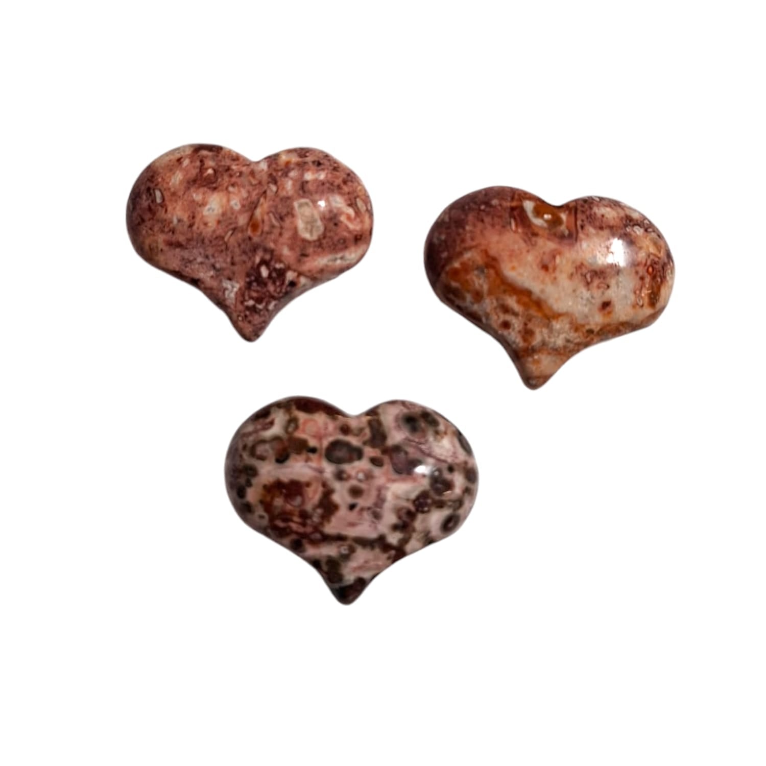 A small, polished puff heart crafted by GeoFossils from leopard skin jasper, featuring a natural pattern of earthy tones, including warm browns, soft pinks, and sandy yellows, with unique spots resembling a leopard’s coat. The heart has a smooth, rounded shape that highlights the stone’s intricate, mottled appearance. The rich, organic look of the leopard skin jasper heart evokes a sense of grounding, protection, and connection to nature.