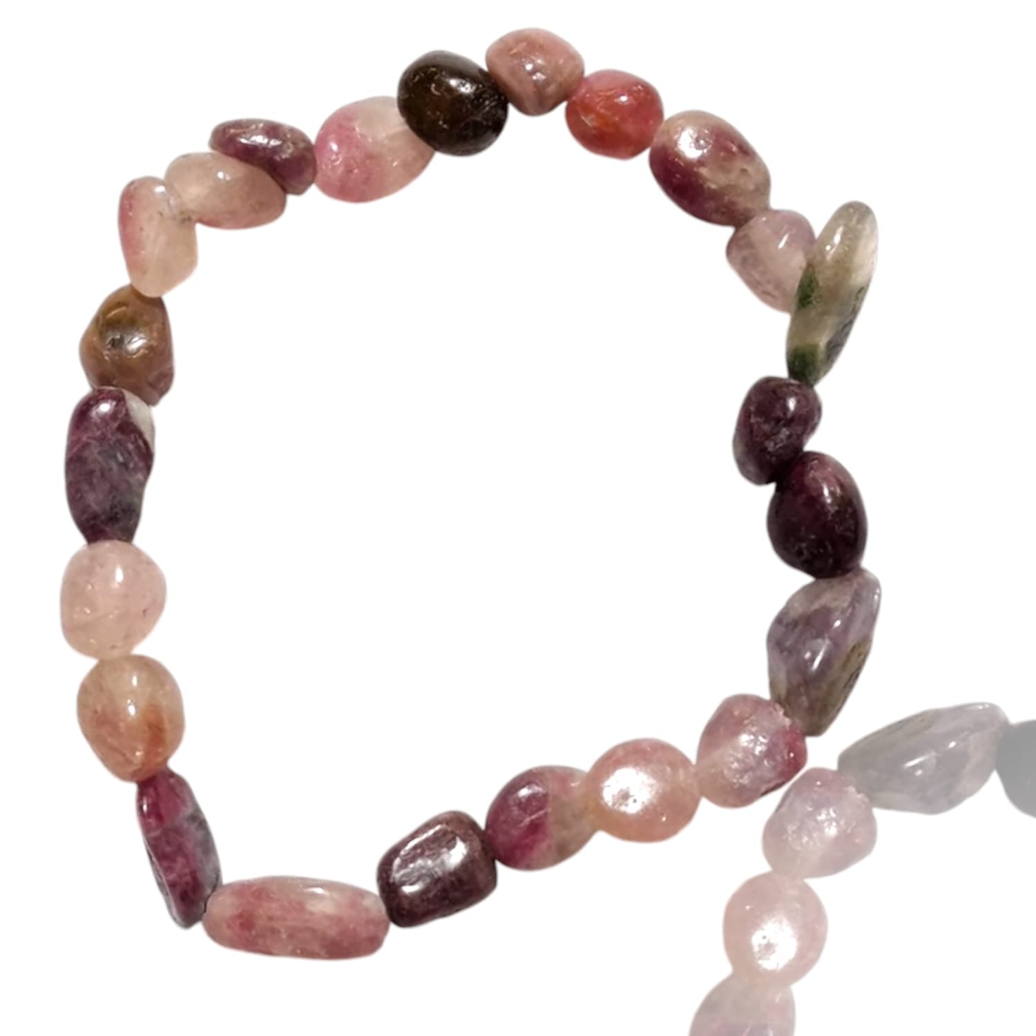 GeoFossils stretch nugget bracelet made from mixed tourmaline stones, featuring a variety of colors, including shades of pink, green, black, and subtle yellow. The stones are irregularly shaped and polished, highlighting their natural, earthy tones and vibrant diversity. The elastic band provides a comfortable, adjustable fit, and the multicolored tourmaline stones create a lively, dynamic aesthetic that reflects the energy and balance of this gemstone.