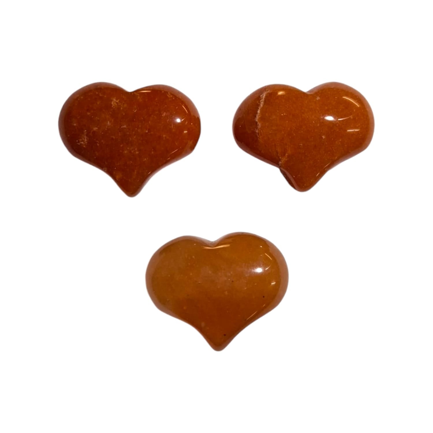 A small, polished puff heart crafted by GeoFossils from peach aventurine, displaying warm, soft peach and apricot tones with a subtle shimmer. The heart has a smooth, rounded shape that highlights the stone’s gentle sparkle and natural variations. The soothing, warm appearance of the peach aventurine heart evokes a sense of optimism, comfort, and joy.