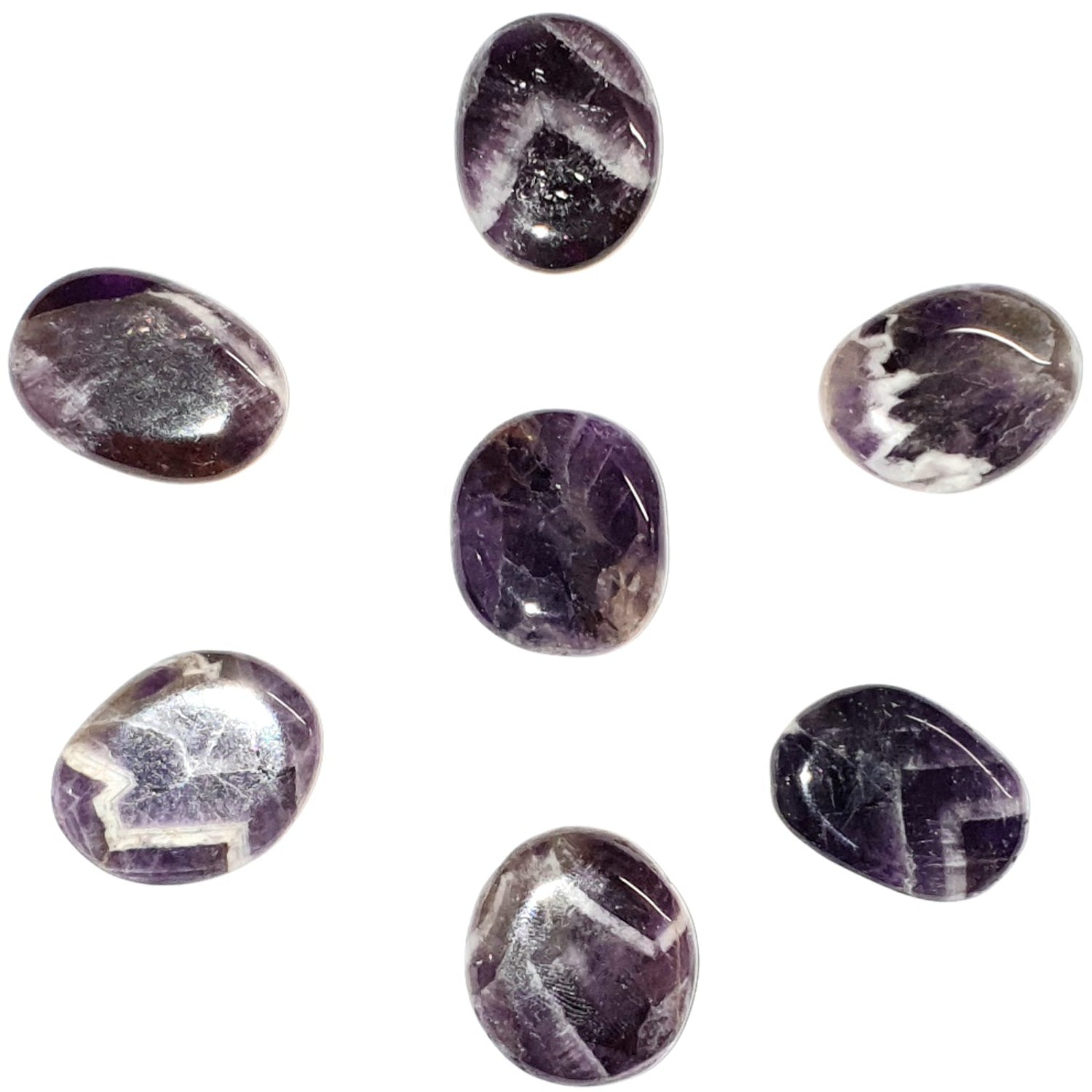 A collection of Handmade Amethyst Chevron Mini Ovals showcasing deep purple hues. Each oval is polished and designed for easy carrying, offering calming, protective, and spiritual energies. Perfect for pocket stones, meditation, or enhancing spiritual practices.