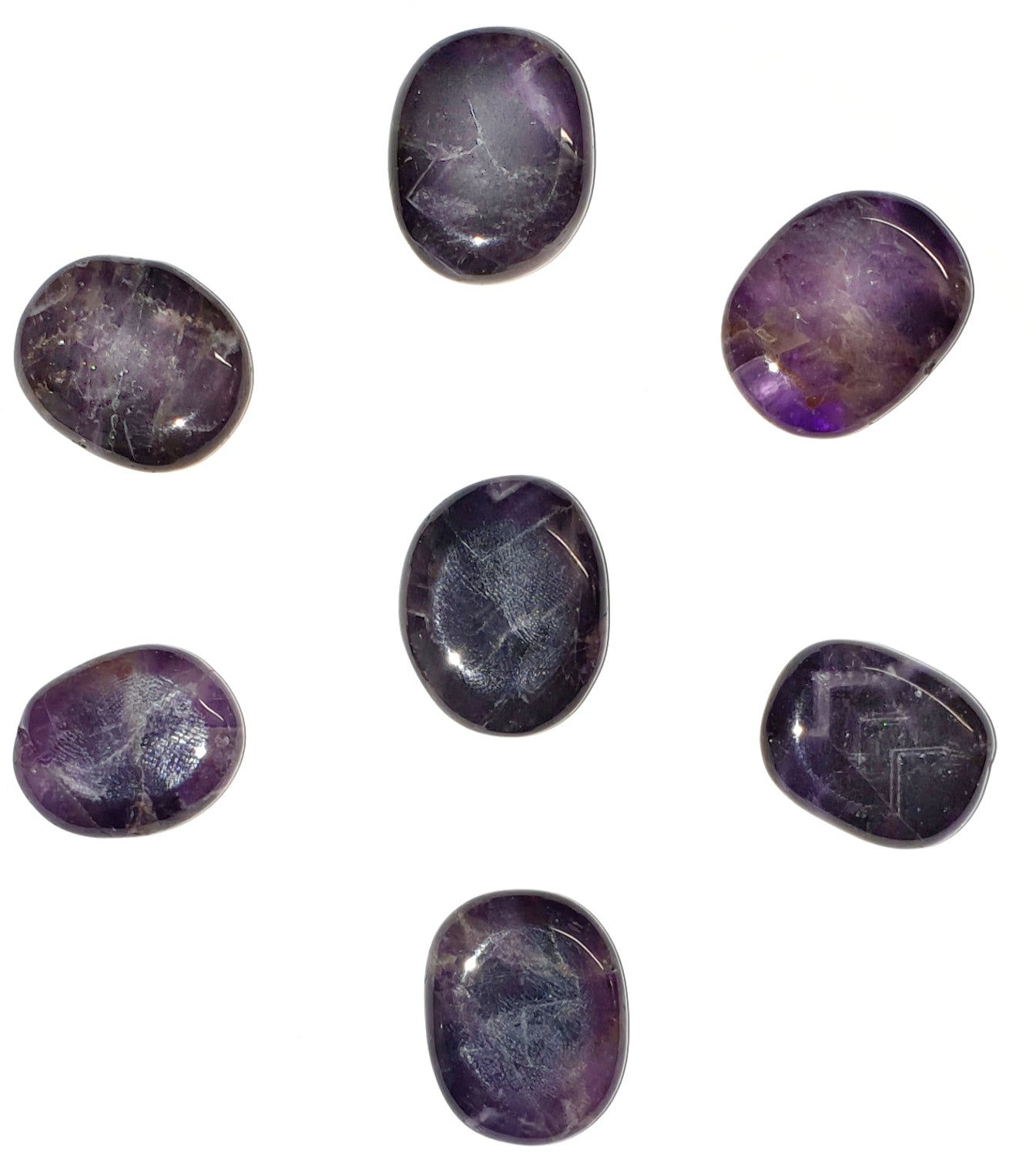 A collection of Handmade Amethyst Mini Ovals showcasing deep purple hues. Each oval is polished and designed for easy carrying, offering calming, protective, and spiritual energies. Perfect for pocket stones, meditation, or enhancing spiritual practices.